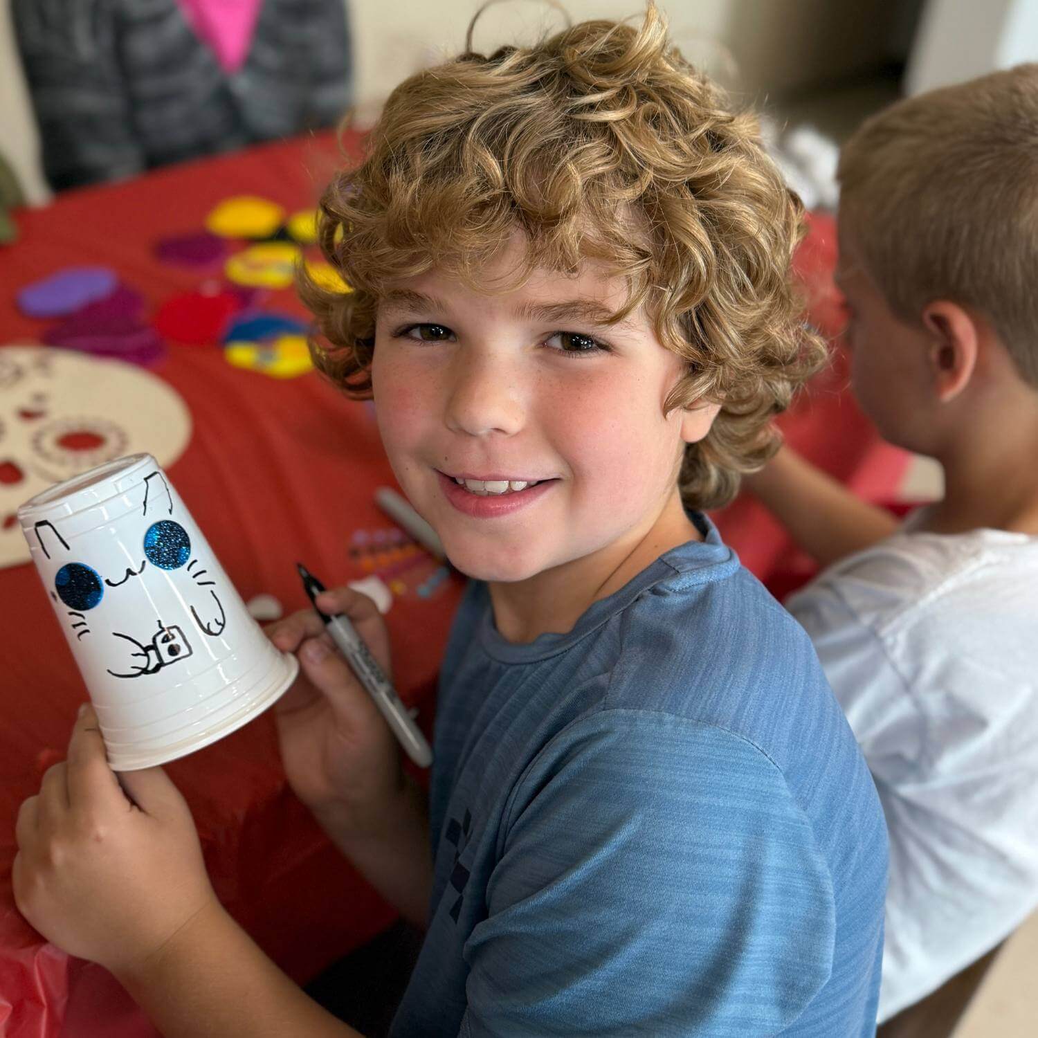 lower school student making crafts